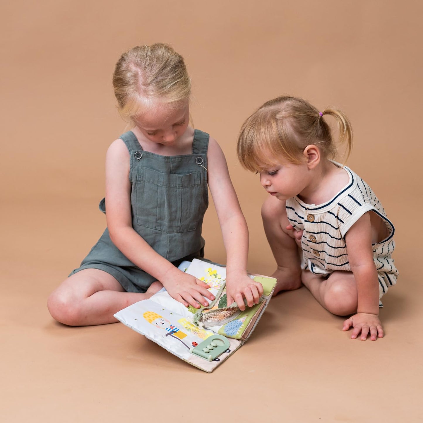 Taf Toys My First Busy Book. Baby Activity Book, Soft Cloth Touch & Feel Book for Toddlers. Montessori Busy Board. Early Learning Developmental Toy, Sensory Play. Suitable for Boys & Girls 18 months +