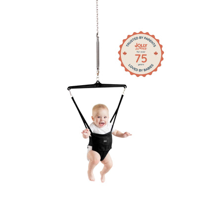 Baby using The Original Jolly Jumper Baby Exerciser with door clamp, with colorful toys attached for fun and exercise.