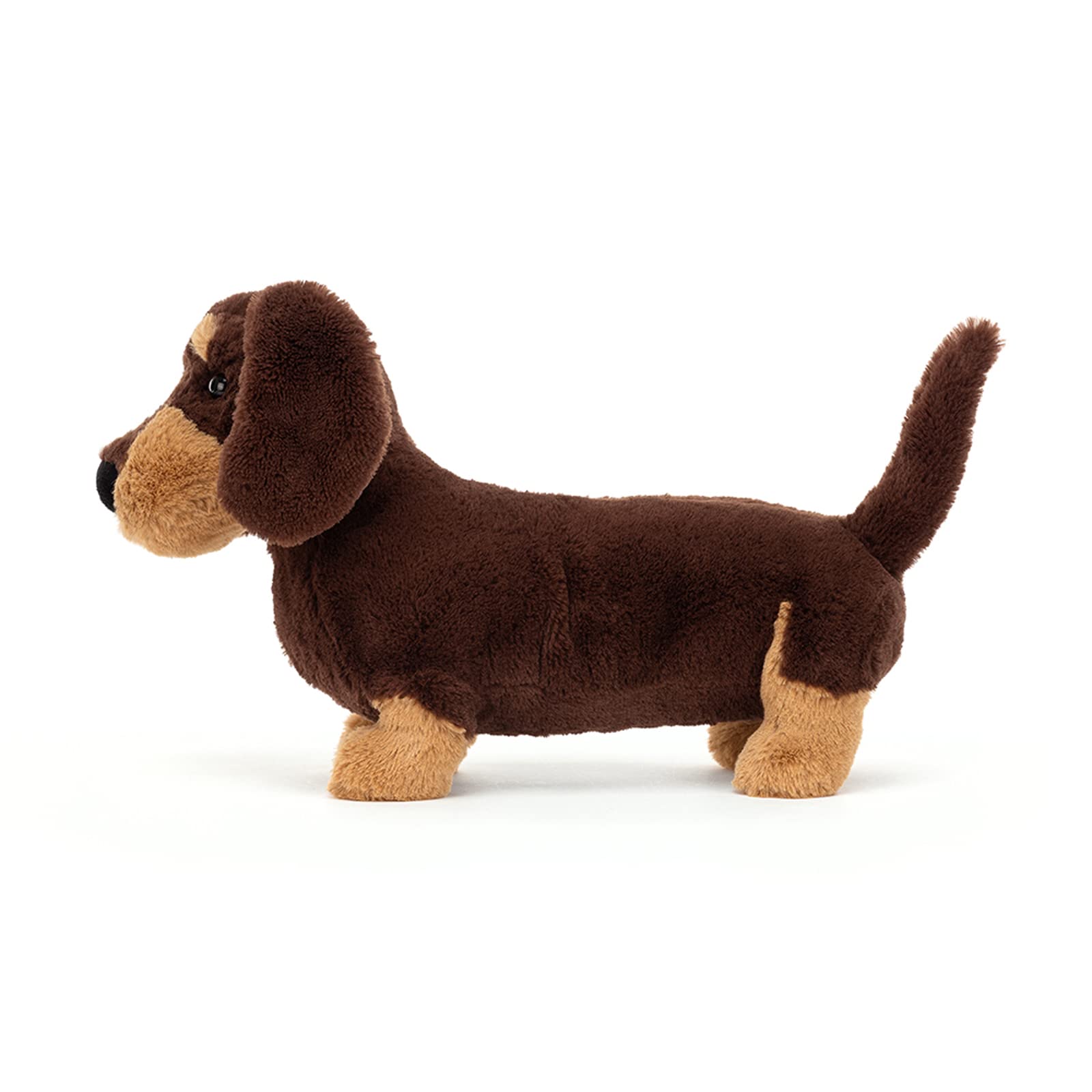 Soft Jellycat Otto Sausage Dog plush toy in a playful pose, showcasing its long body and floppy ears.