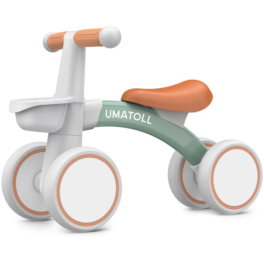 Umatoll baby balance bike in green with removable basket and adjustable seat for toddlers aged 12-24 months.