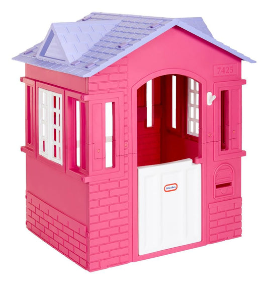 Pink Little Tikes Cape Cottage princess playhouse with working doors, windows, and shutters for kids' outdoor imaginative play.
