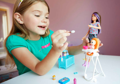 Barbie FHY98 Family Babysitter Brunette Doll with baby and highchair playset in a colorful scene, showcasing accessories.