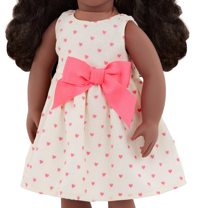 Our Generation 18-inch doll outfit featuring a deluxe jacket and dress combo with accessories in bright colors.
