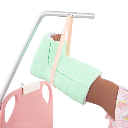 Our Generation doll hospital bed with medical accessories, including a gown, stethoscope, and kit for 18-inch dolls.