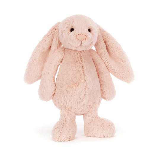 Bashful Blush Bunny plush toy by Jellycat, featuring soft fur and floppy ears, sitting with a gentle expression.