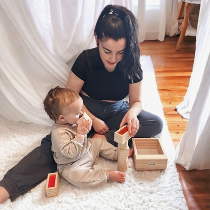 Jaques of London wooden sensory blocks for babies, featuring colorful wooden toy blocks with sound elements for early development.