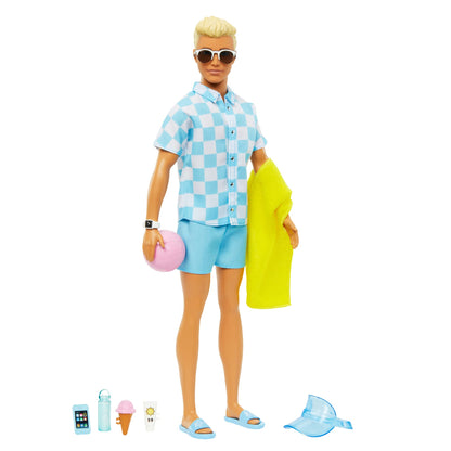 Blonde Ken doll in blue button-down shirt and swim trunks, with visor, towel, and beach accessories from Barbie.