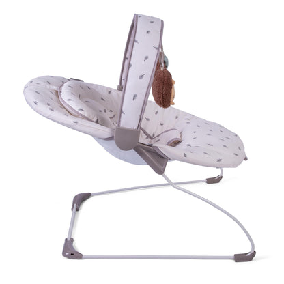 Red Kite Cozy Bounce musical baby bouncer in woodland walks print with padded seat and toy bar for infants.
