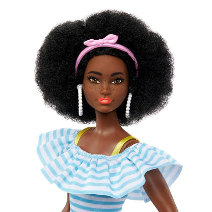 Barbie doll with roller skates, trendy outfit, storytelling accessories, and pet puppy, featuring a natural afro hairstyle.