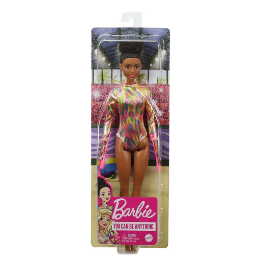 Brunette Barbie rhythmic gymnast doll in colorful leotard with accessories, measuring 12 inches tall.