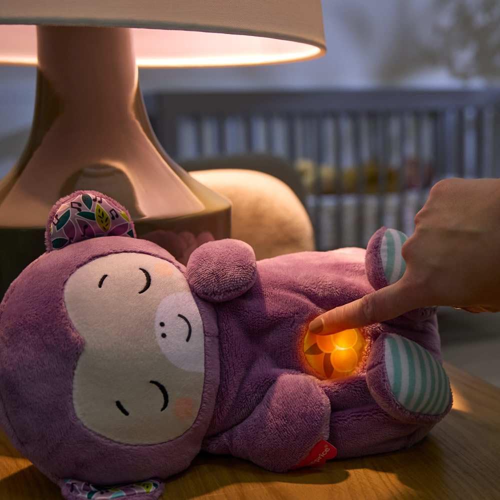 Fisher-Price Baby Soothe ‘n Snuggle Purple Monkey plush toy with built-in sound machine, lights, and breathing motion for newborns.