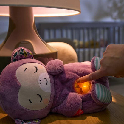 Fisher-Price Baby Soothe ‘n Snuggle Purple Monkey plush toy with built-in sound machine, lights, and breathing motion for newborns.