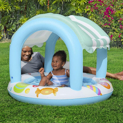 Bestway inflatable sweet shop paddling pool for kids with shade, perfect for toddlers aged 2 and up in a garden setting.