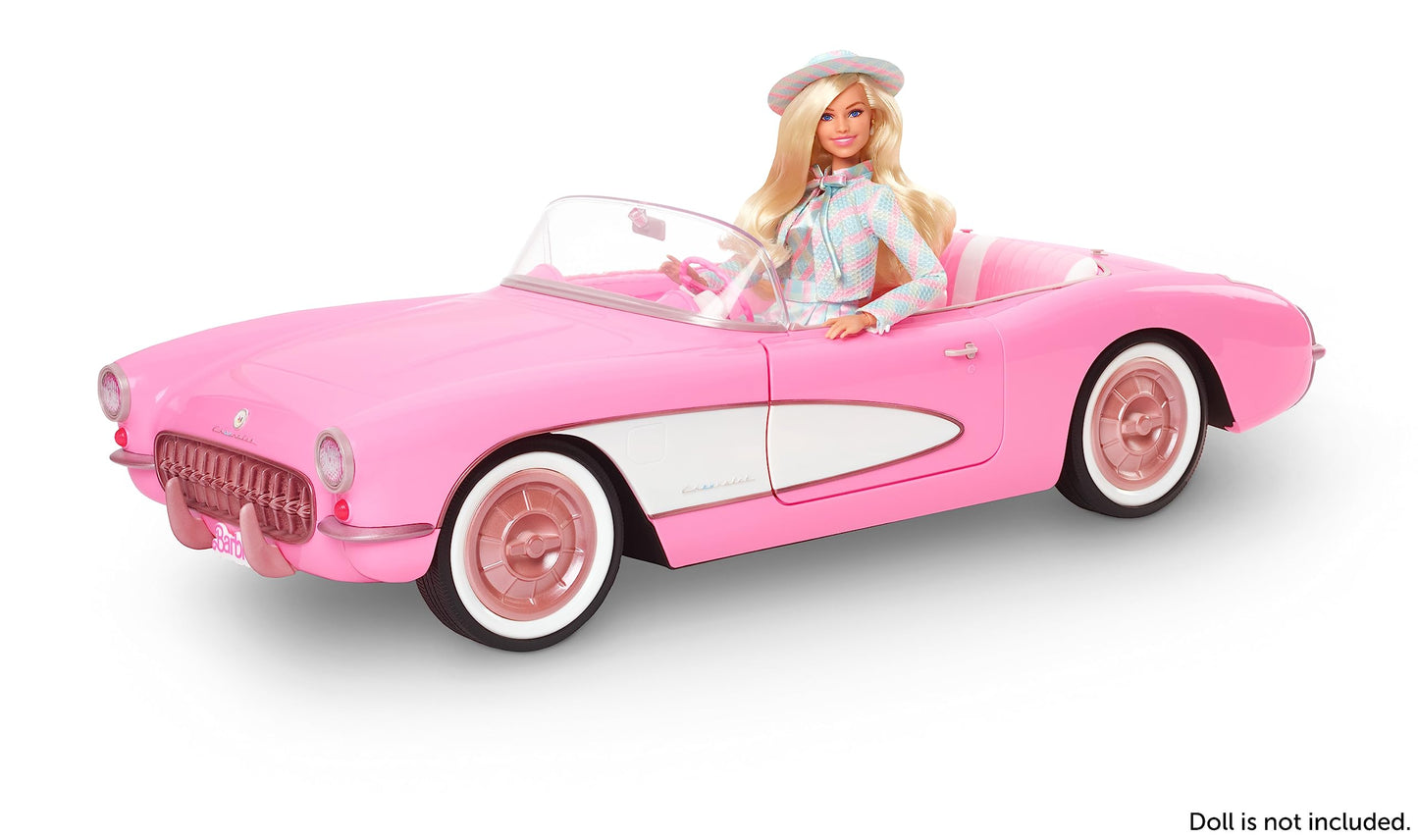 Vintage-inspired Barbie pink Corvette convertible with white wall tires and trunk storage, ideal for collectors.