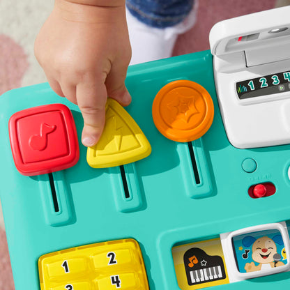 Fisher-Price Laugh & Learn Mix & Learn DJ Table for babies and toddlers, with colorful lights, sounds, and musical buttons.