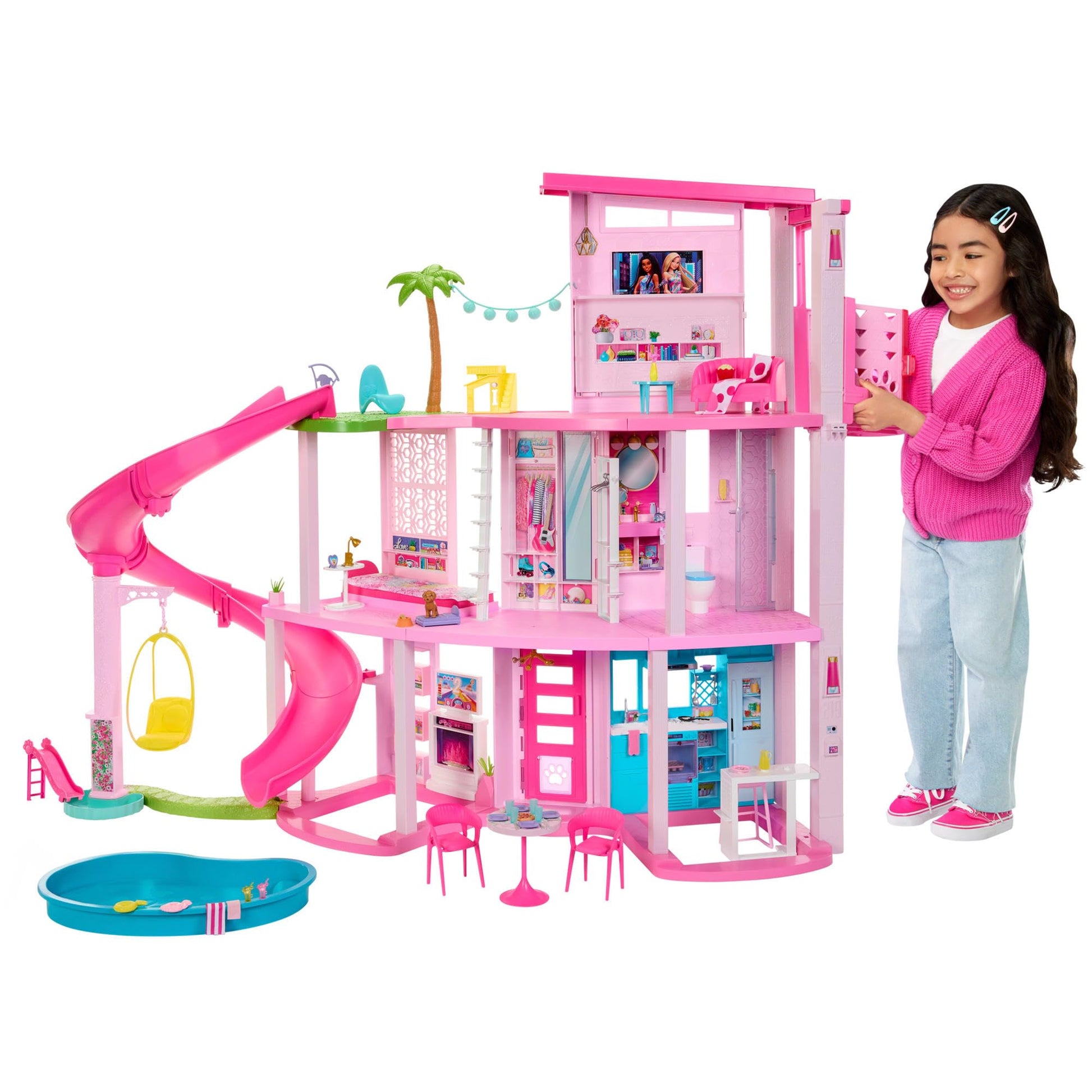 Barbie Dreamhouse with three stories, pool, slide, elevator, and 75 accessories for imaginative play.