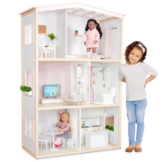 Our Generation dollhouse playset featuring movable furniture pieces for a bedroom, kitchen, and bathroom for 18-inch dolls.