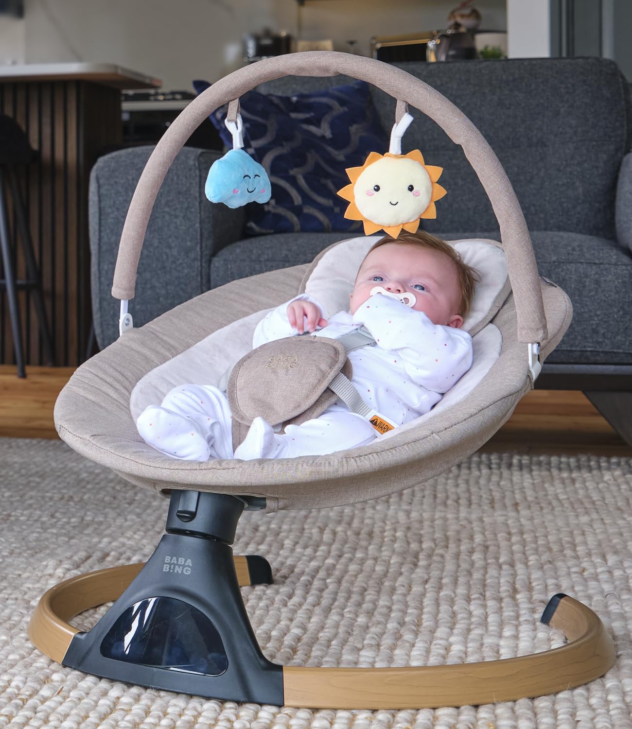 BABA BING beige electric baby swing chair with Bluetooth, digital display, and five swinging options for infants and toddlers.