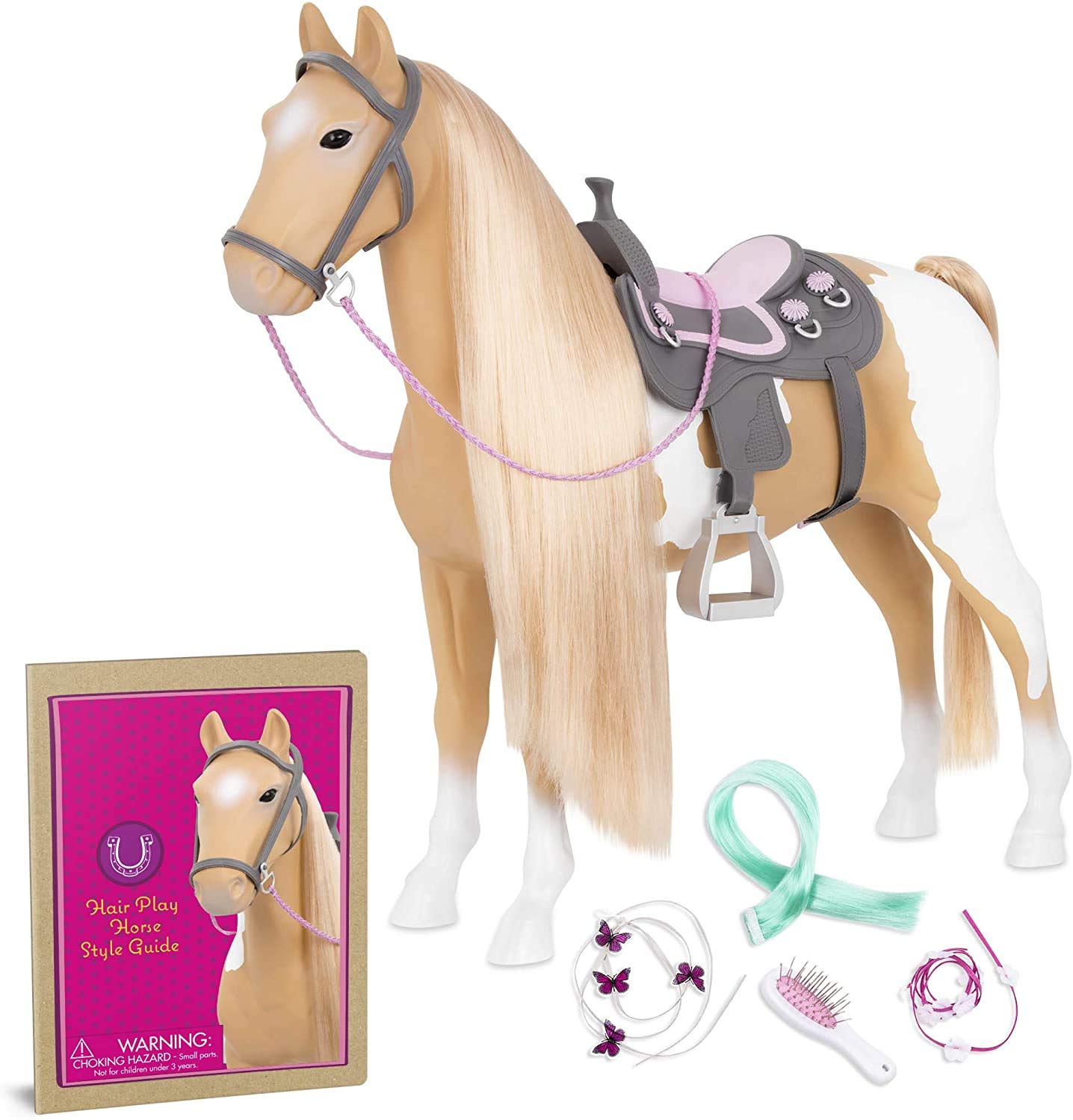 Our Generation bd38030z Palomino Pain toy horse with accessories including bridle, hair brush, ribbons, green extension, and saddle.