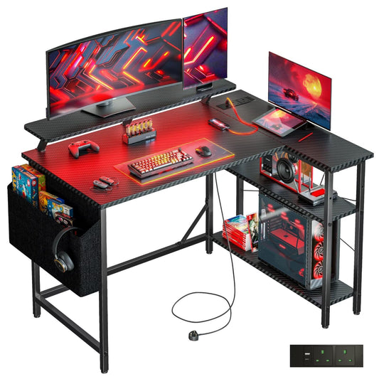 DOMSHOCT L-shaped gaming desk with LED lights, monitor stand, storage bag, adjustable shelves, and power outlets in carbon black