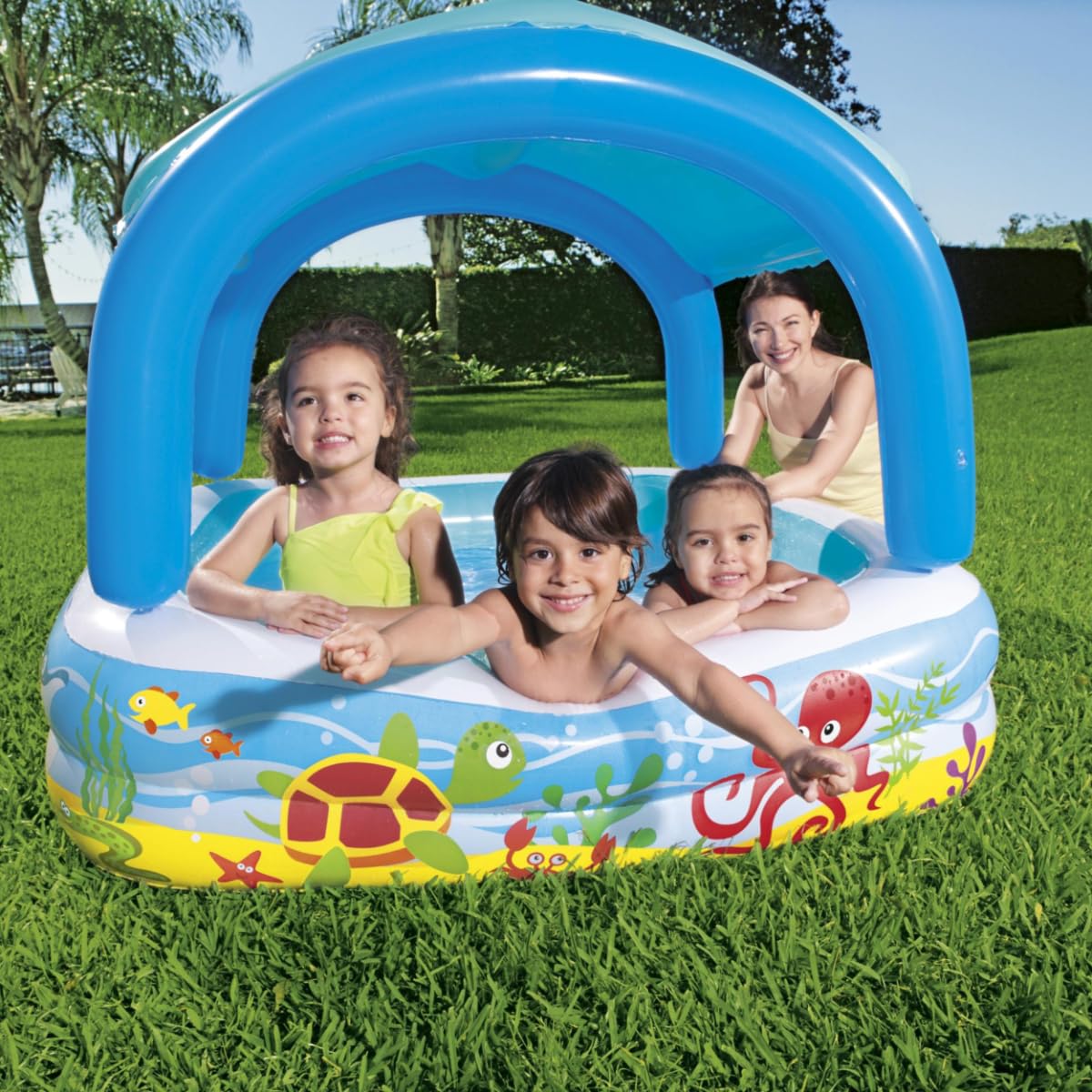 Bestway inflatable paddling pool for kids, featuring a shade canopy, ideal for toddlers ages 2 and up in an outdoor garden setting.