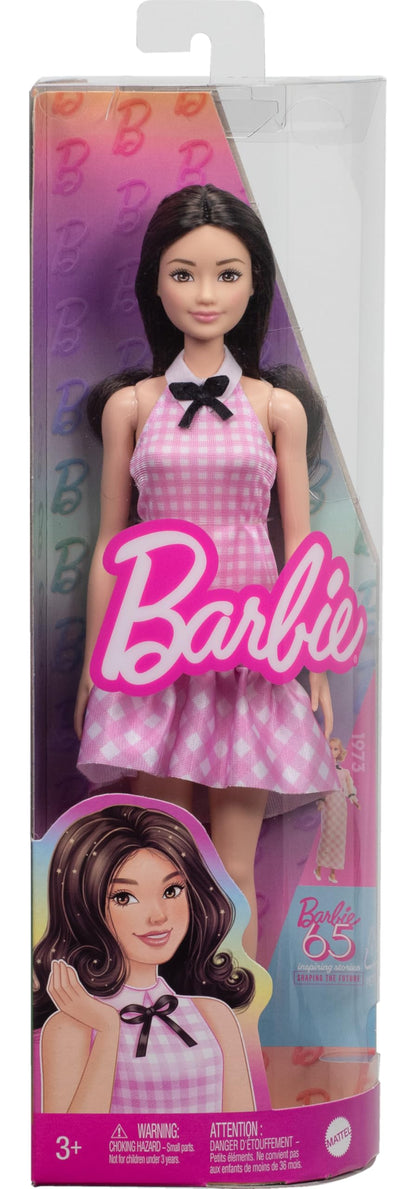 Barbie Fashionistas Doll #224 with black wavy hair, pink gingham dress, accessories, celebrating 65th anniversary.