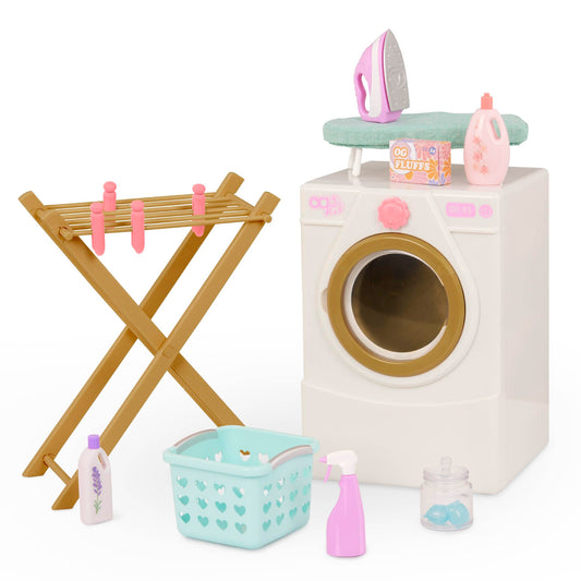 Our Generation doll washing machine with drying rack, iron, and cleaning set for 18-inch dolls in a colorful play setting.