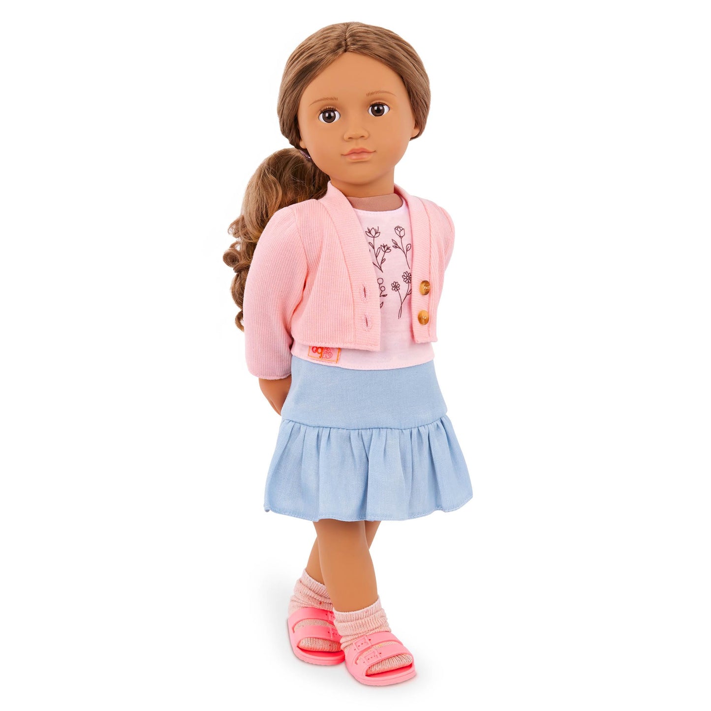 Our Generation 18-inch doll outfit featuring a pink sweater, blue skirt, and floral print top for pretend play.