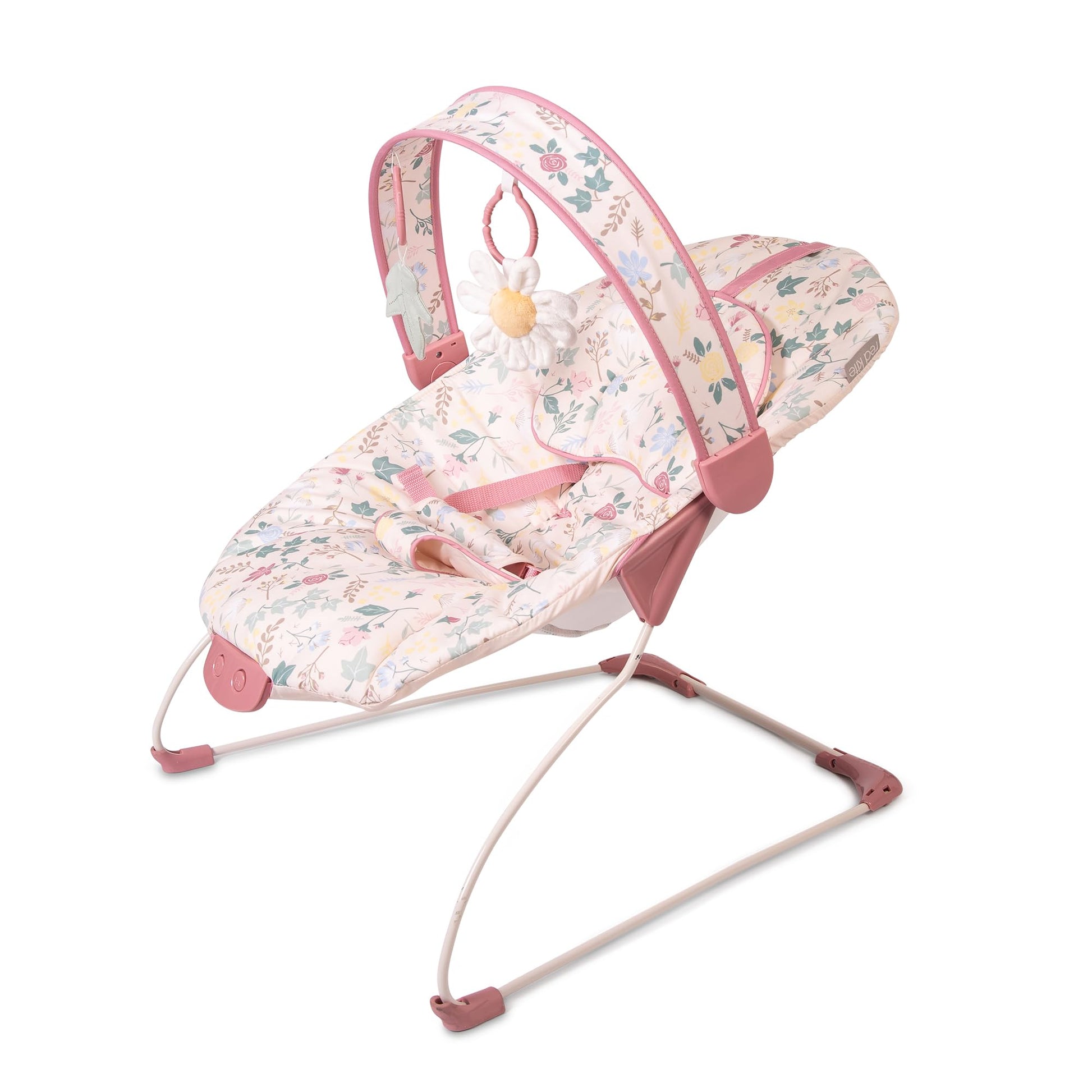 Red Kite Cozy Bounce musical baby bouncer in rose and ivy fabric with plush padding and hanging toys, designed for infants' comfort.