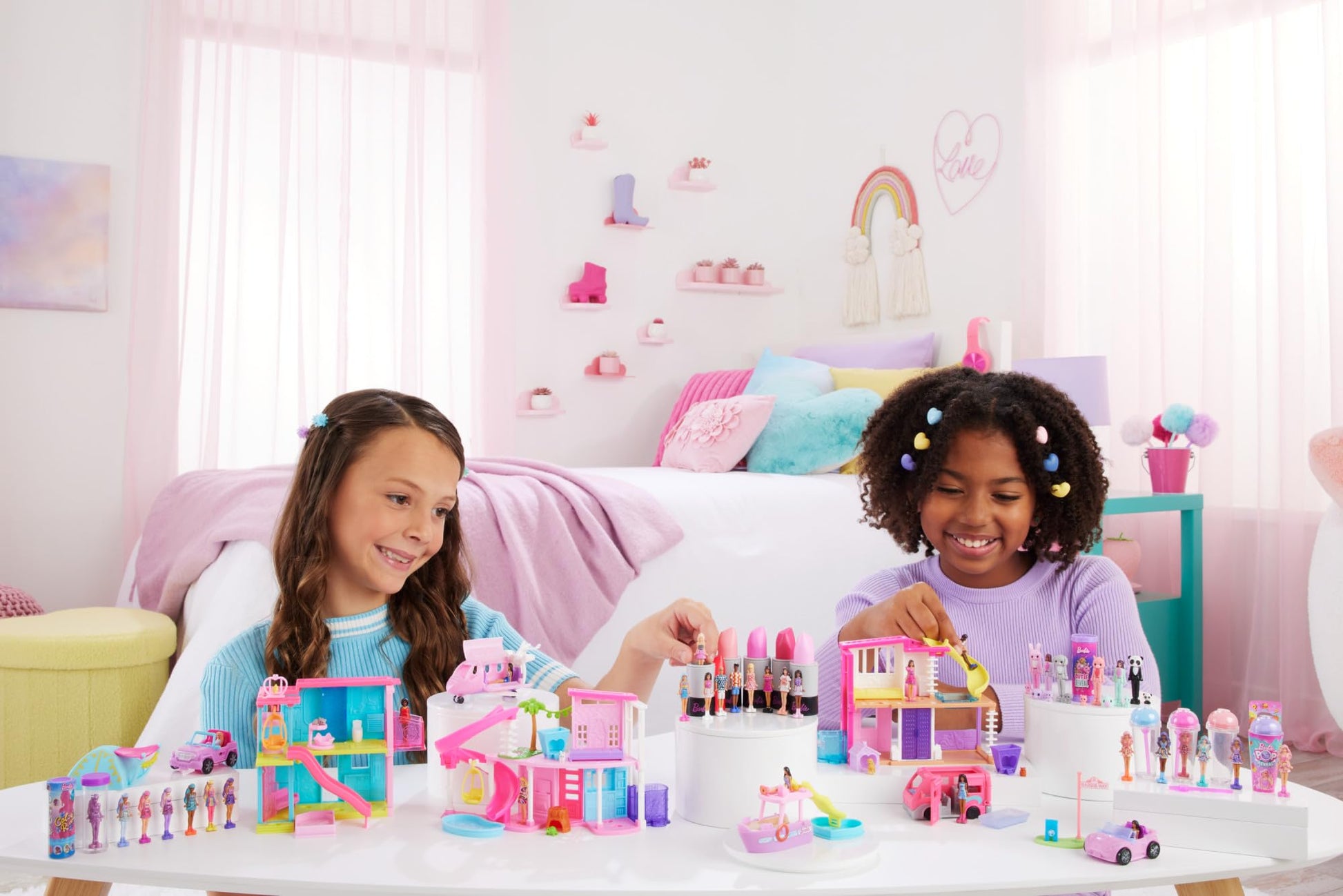 Mini BarbieLand doll and toy vehicle set featuring a 1.5-inch Barbie doll, DreamCamper with working doors and color-change pool.