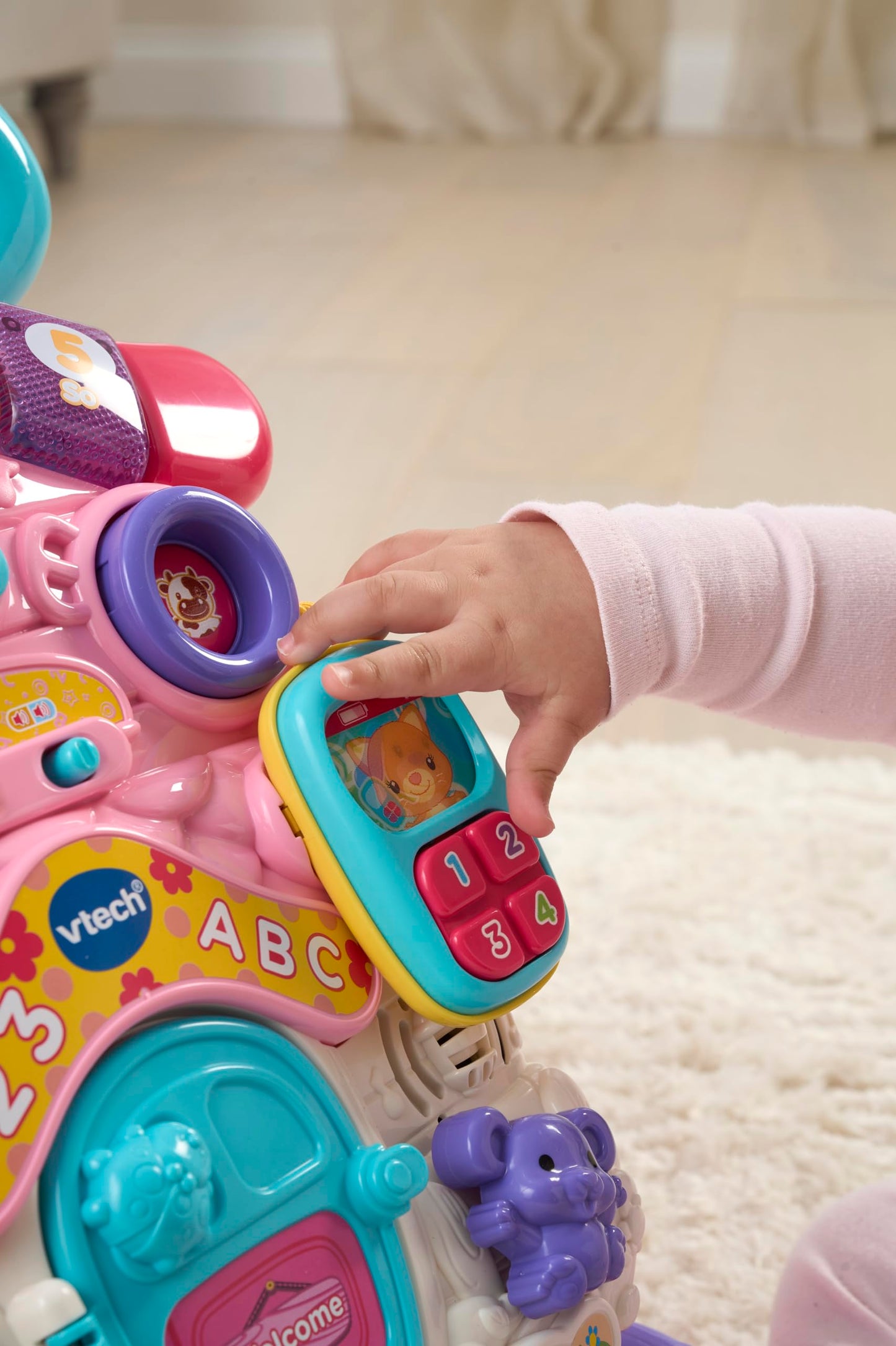 VTech First Steps Baby Walker in pink with shapes, sounds, music, and pretend play features for infants and toddlers.