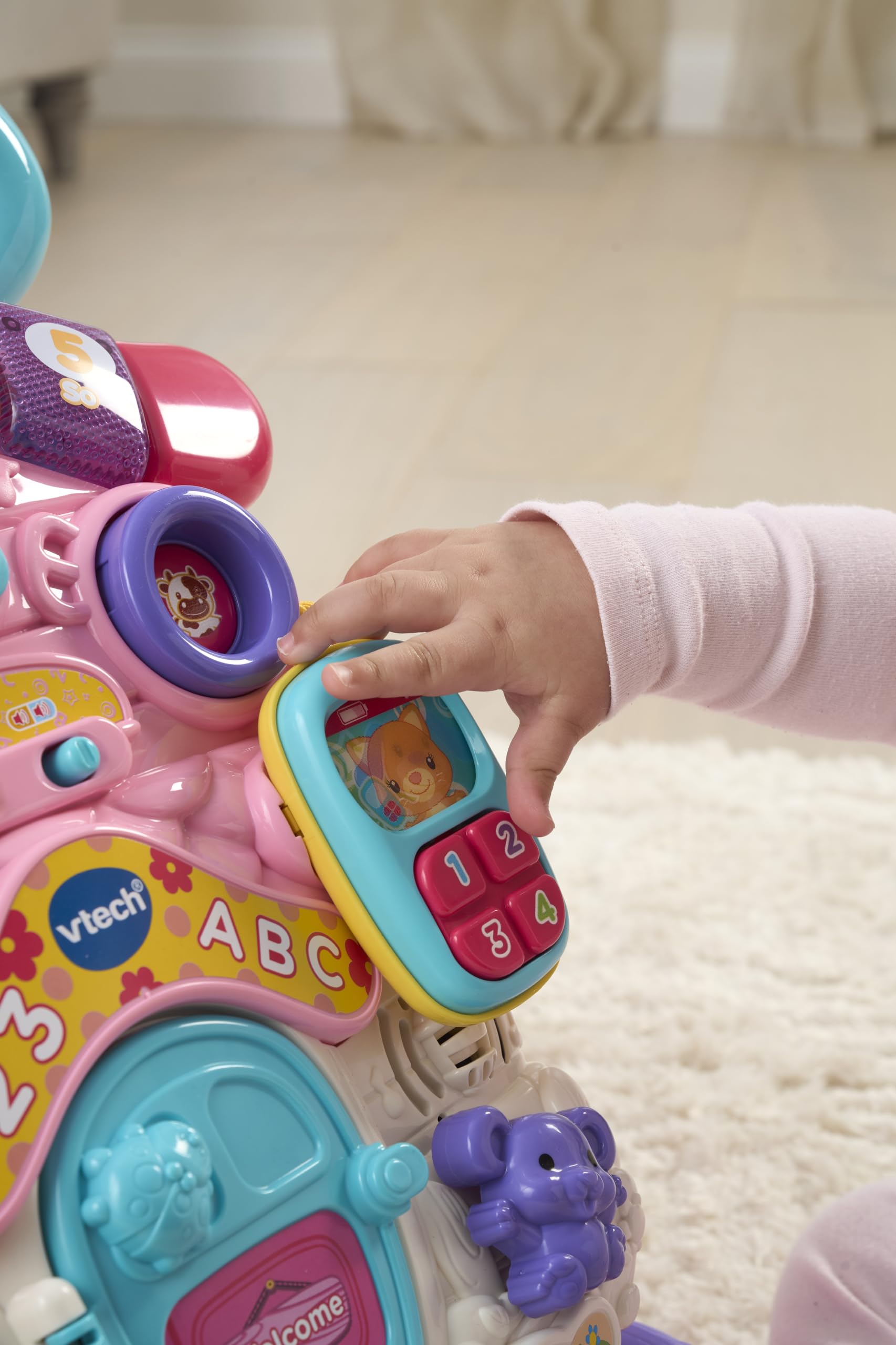 VTech First Steps Baby Walker in pink with shapes, sounds, music, and pretend play features for infants and toddlers.
