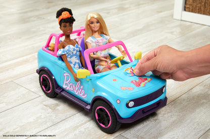 Barbie Hot Wheels remote control SUV with stickers, storing space for 2 Barbie dolls and accessories, in colorful design.