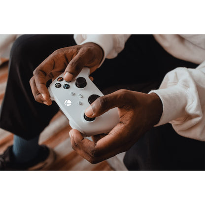 Xbox Wireless Controller in Robot White for Xbox Series X|S, One, and Windows devices, featuring ergonomic design and textured grips.