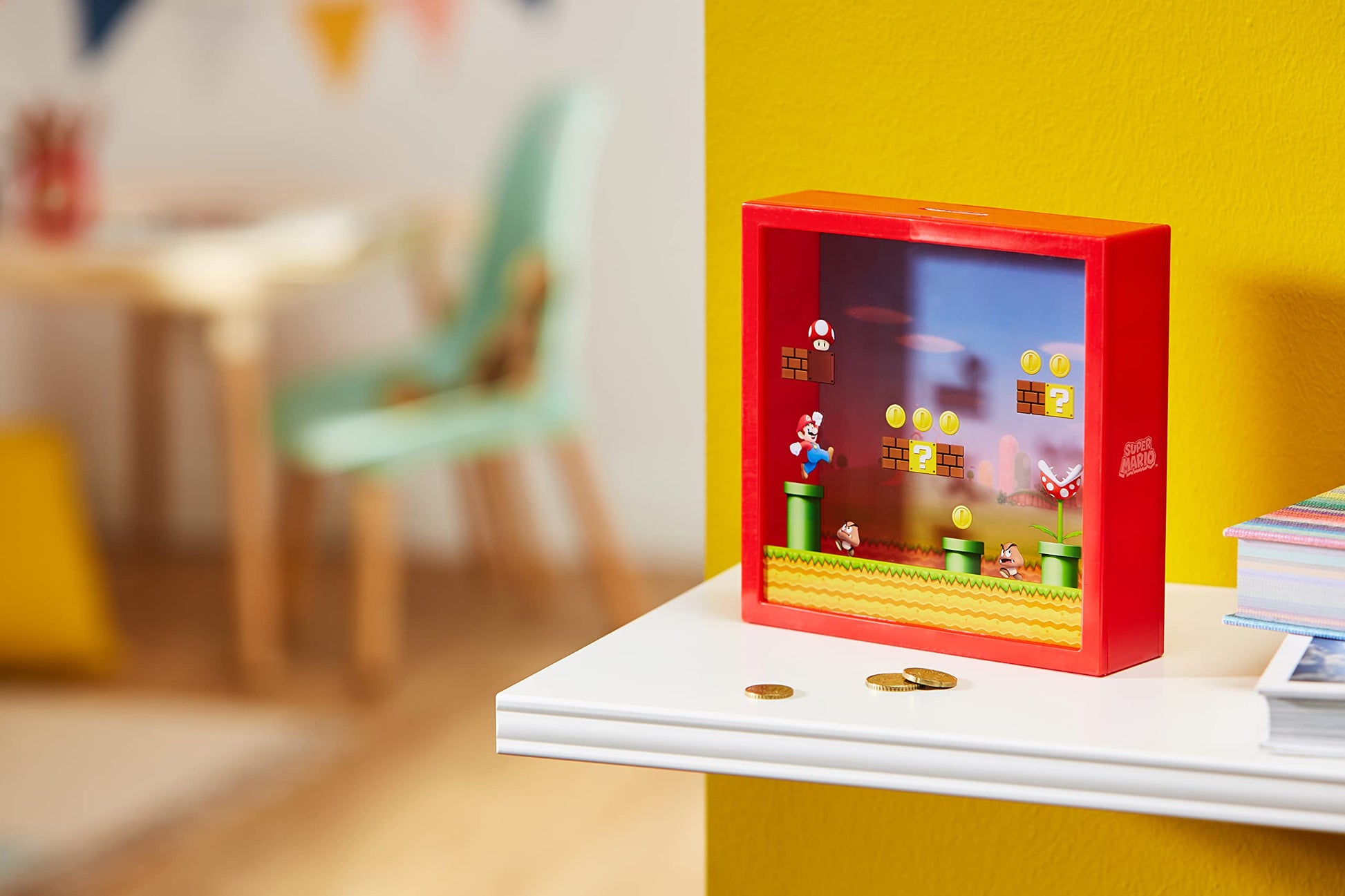 Super Mario money box by Paladone, an officially licensed Nintendo piggy bank featuring Mario for saving and gifting, 18cm tall.