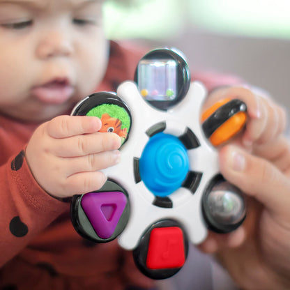 Baby Einstein Curiosity Clutch fidget toy and Pop It rattle, BPA-free infant teether for babies 3 months and older.