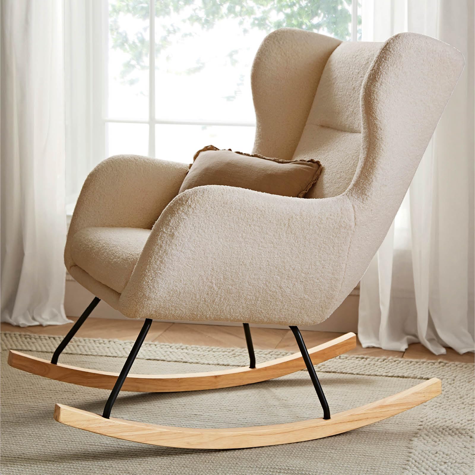 Light beige CuddleCo Marley nursing chair and footstool for nursery, featuring a cozy teddy fabric, ideal for breastfeeding comfort.