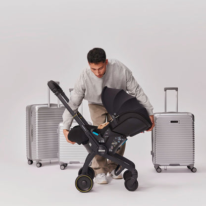 Doona X Baby Car Seat & Travel Stroller Nitro Black - Convertible 0+ Car Seat and Pram with 3 Recline Positions - Ergonomic Pushchair and Travel System - ISOFIX Base Sold Separately