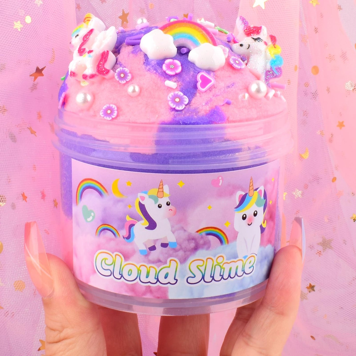 Pink and purple unicorn cloud slime with rainbow charms, soft and stretchy sensory toy for kids, scented and fun for boys and girls.