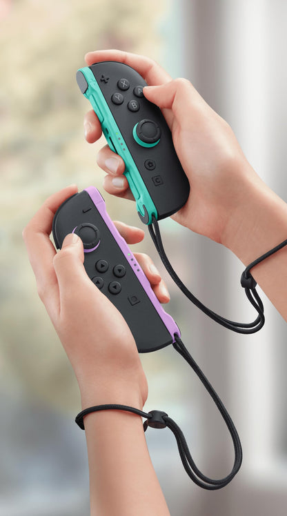 Nintendo Joy-Con controllers in light purple and light green, designed for Nintendo gaming consoles, shown with colorful buttons and joysticks.