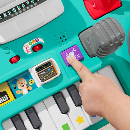 Fisher-Price Laugh & Learn DJ Table for babies and toddlers, musical activity table with lights, sounds, and interactive features.