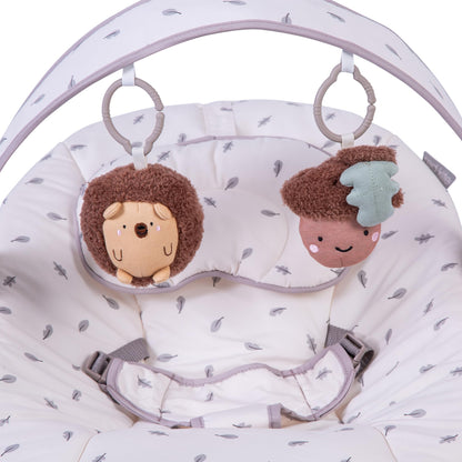 Red Kite Cozy Bounce musical baby bouncer in woodland walks pattern with plush fabric and toy arch for infants.