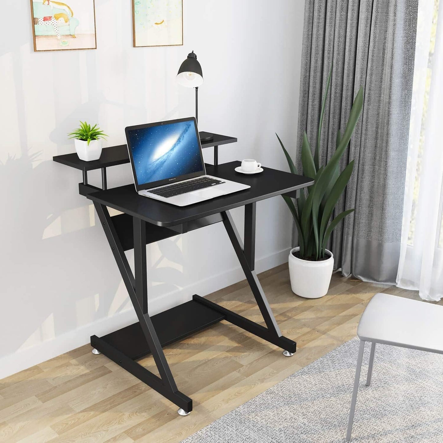 Dripex black Z-shaped computer desk with monitor shelf, storage shelves, and movable wheels for small home office spaces.