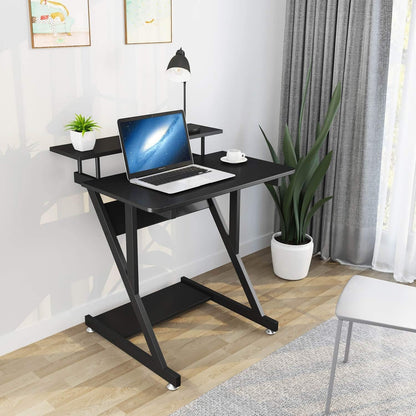 Dripex black Z-shaped computer desk with monitor shelf, storage shelves, and movable wheels for small home office spaces.