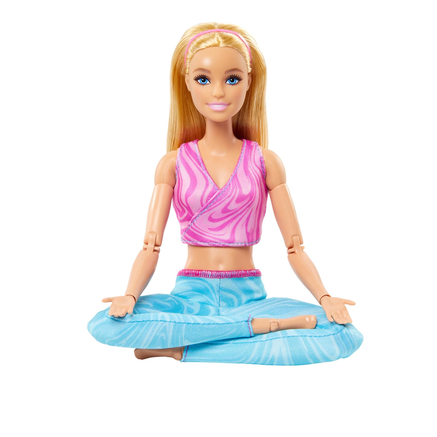 Barbie Made to Move doll with blonde hair in pink sports top and blue yoga pants, showcasing 22 bendable joints.