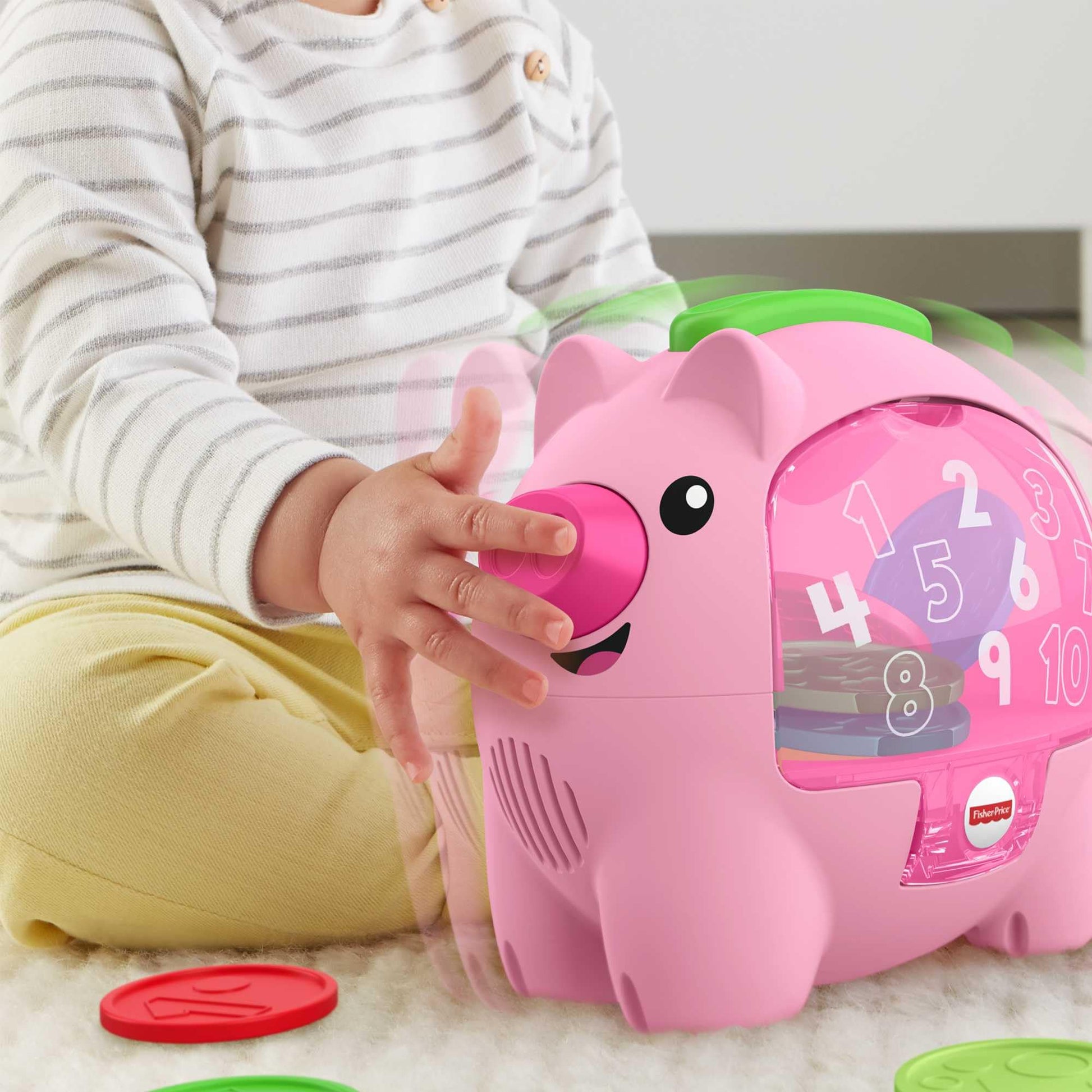 Fisher-Price Laugh & Learn Count & Rumble Piggy Bank toy for babies, featuring colorful design, musical elements, and motion action.