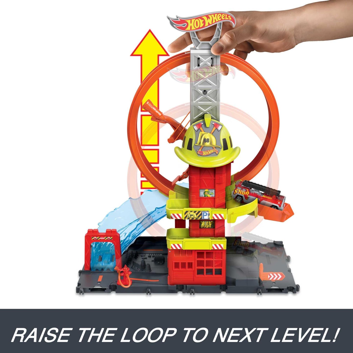 Hot Wheels City playset featuring a toy car, kid-powered elevator, water-like ramp, and fire station with super loop.