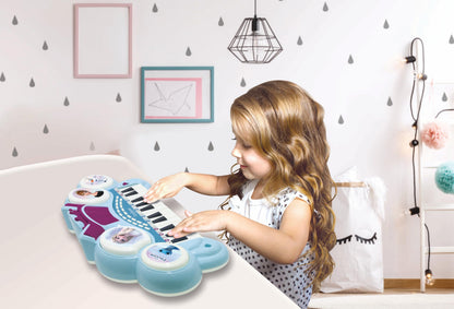 Lexibook Frozen electronic keyboard in blue and purple with seat, microphone, MP3 player, sound effects, and demo tunes.