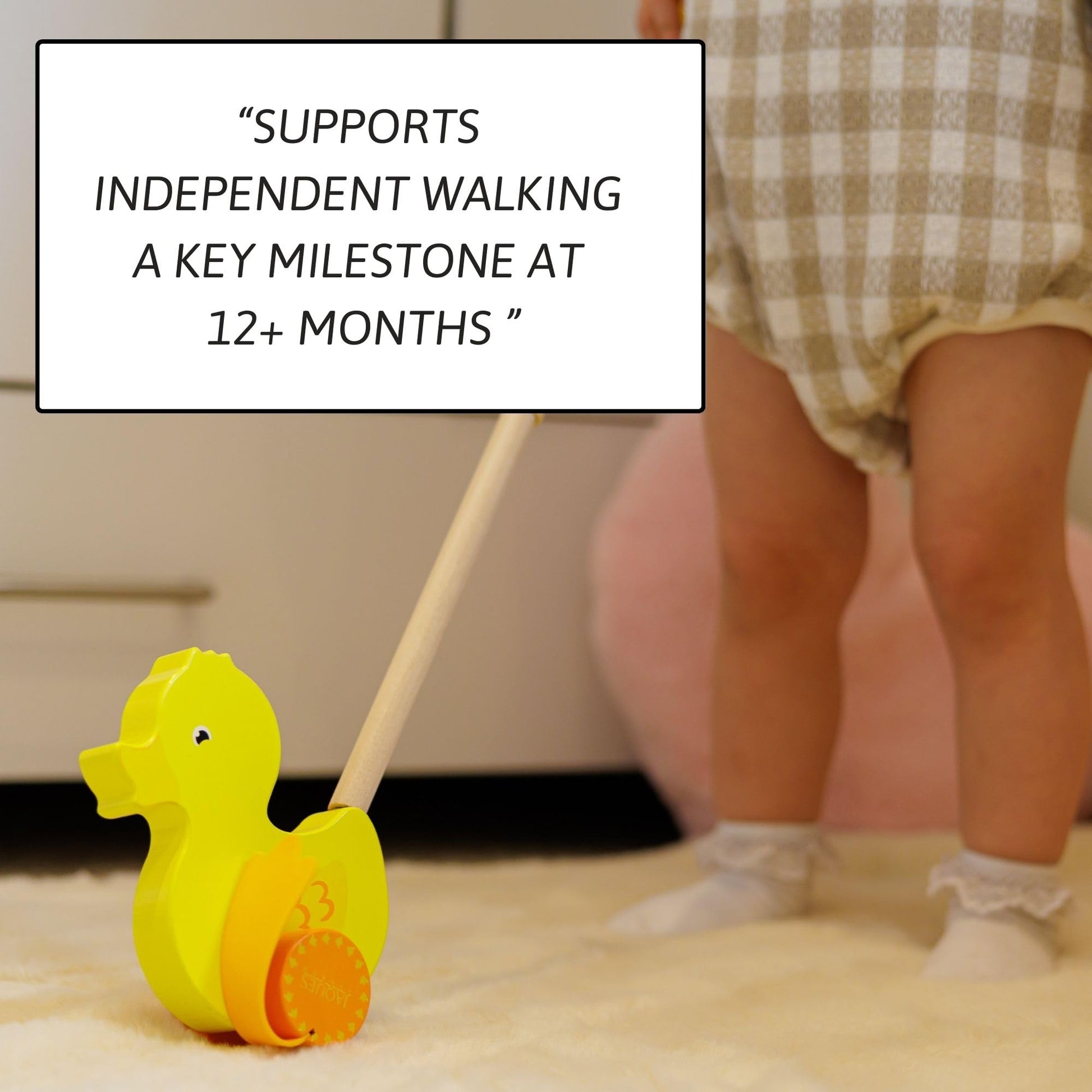 Wooden Waddles the Duck push toy for toddlers by Jaques of London, featuring a classic wooden duck design for 1-year-olds.