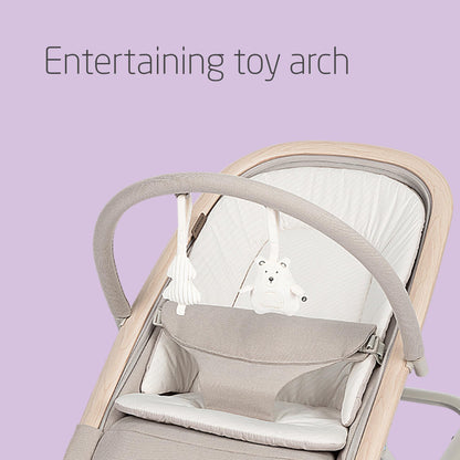 Maxi-Cosi Kori 2-in-1 baby bouncer chair with toy arch, beige fabric, recline positions, lightweight design, and newborn pillow.